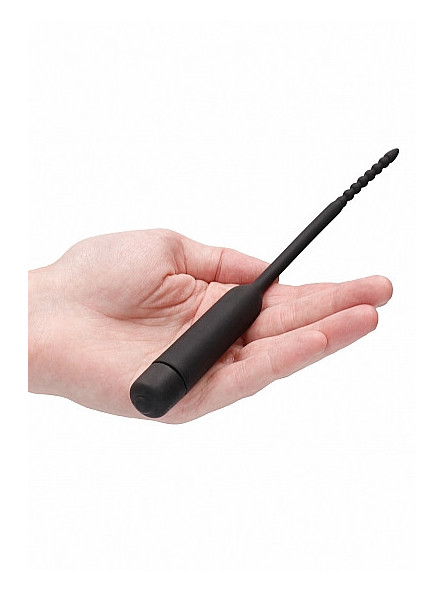 Sonde vibrante en silicone dans une main Sonde vibrante en silicone Bullet Plug With Beaded Tip Ouch!
